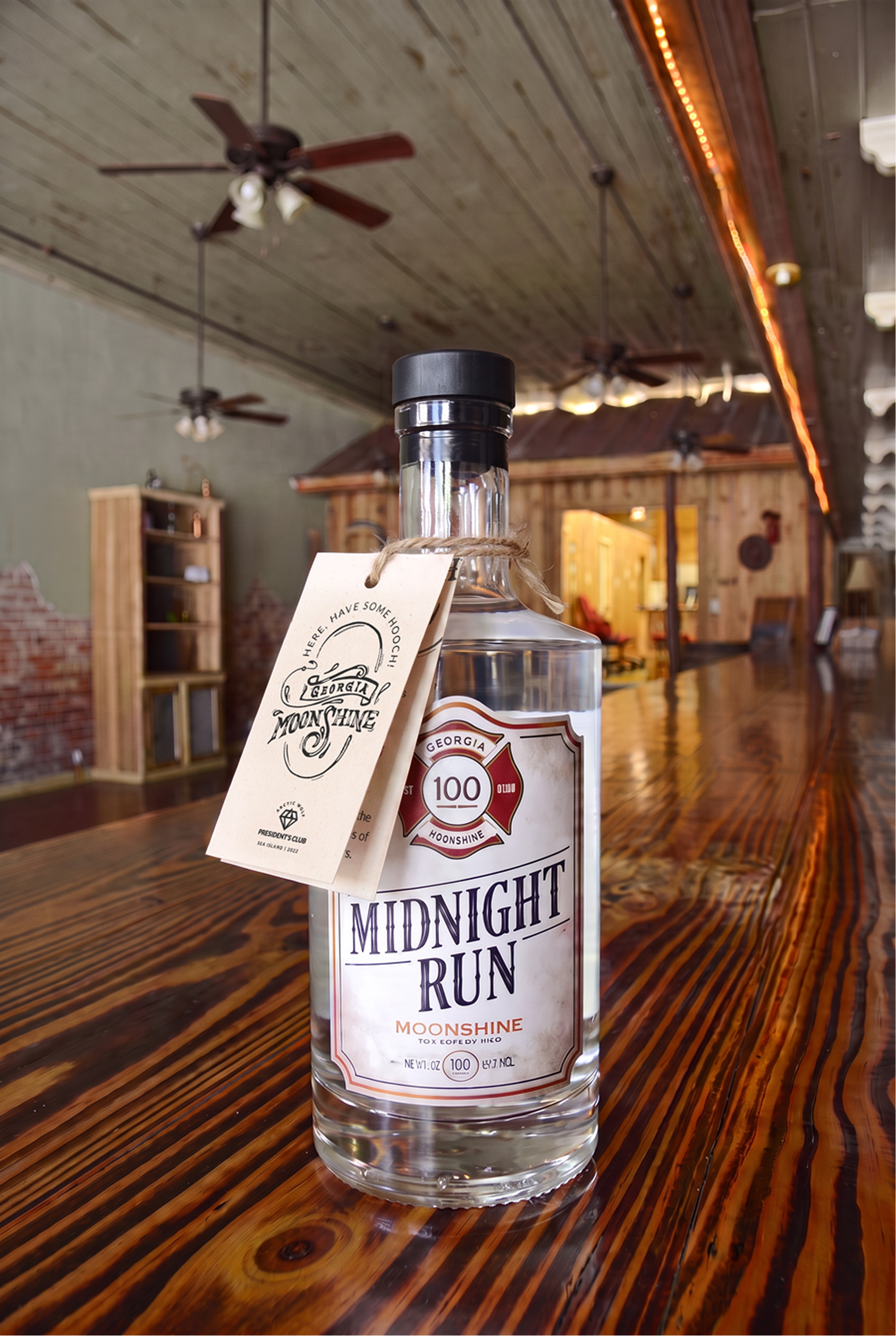 President's Club illustrated moonshine bottle hang tag